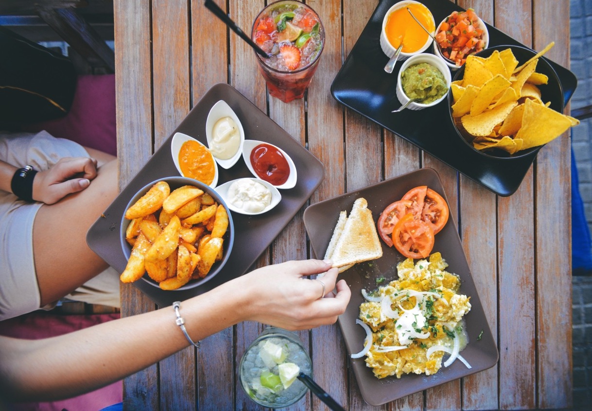 Woman eating mexican food in restaurant